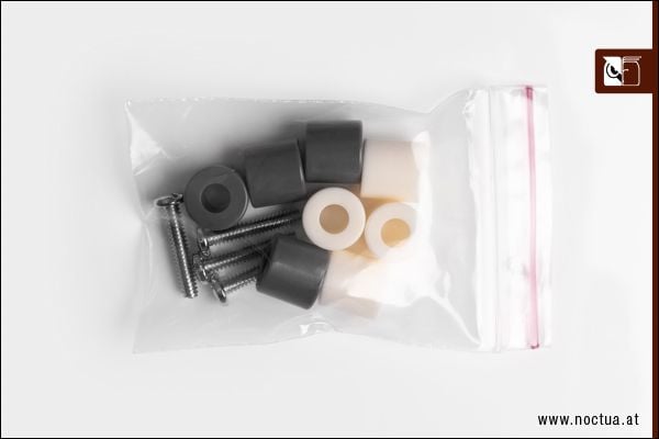 AM4/AM5 parts in a bag, four screws, four grey spacers and four white spacers