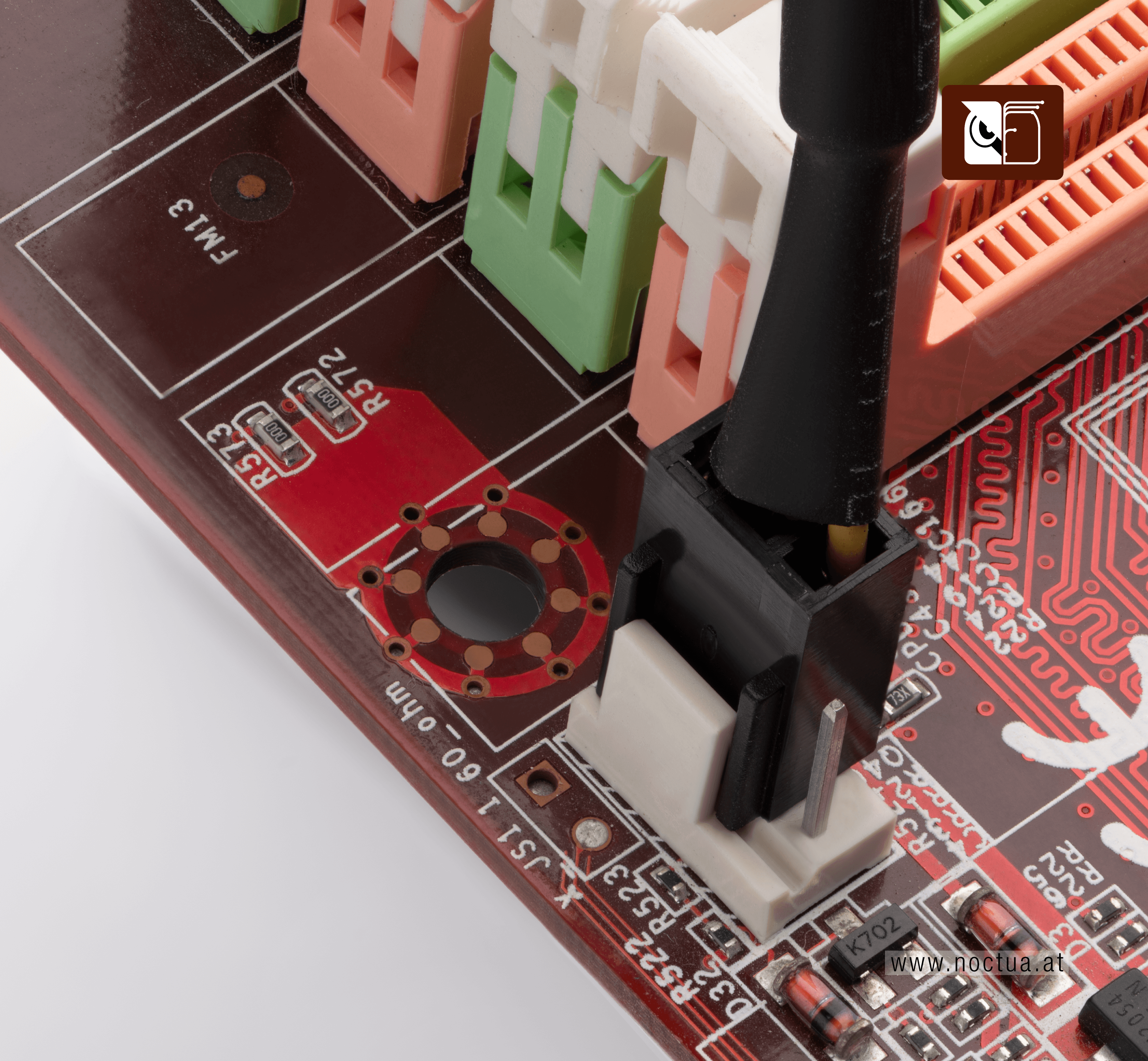A 3-pin fan connector plugged into a 4-pin CPU fan header on a motherboard, showing that the connector fits while leaving one pin unused.