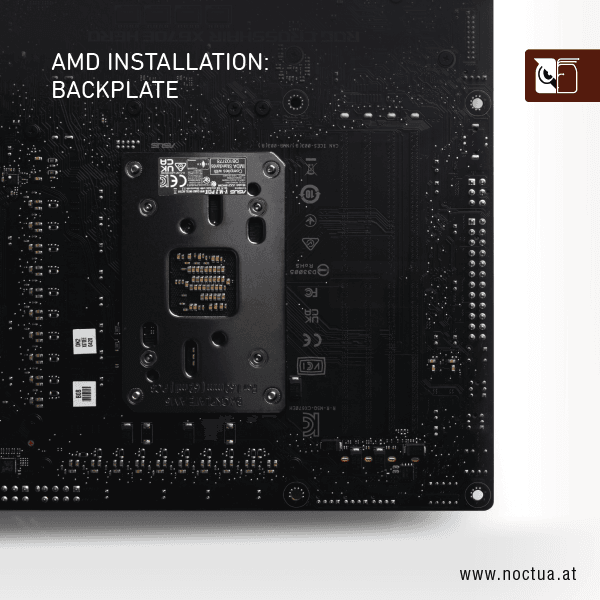 The back side of a motherboard, showing the AMD CPU cooler backplate installed. The backplate is centred and secured with four screws.