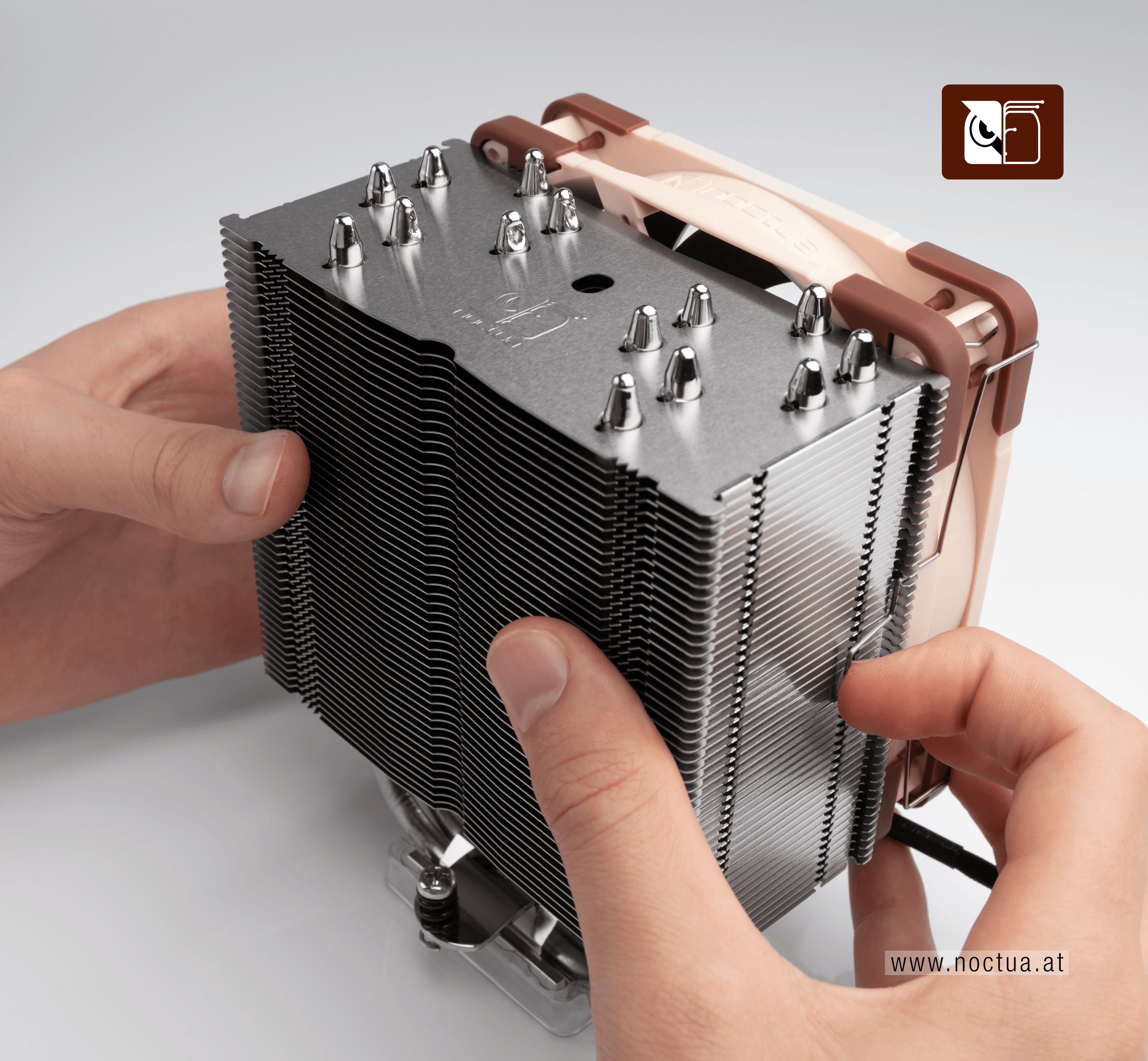 A fan is installed on a cooler by holding the fan to the heatsink and pulling the fan clips towards the heatsink.